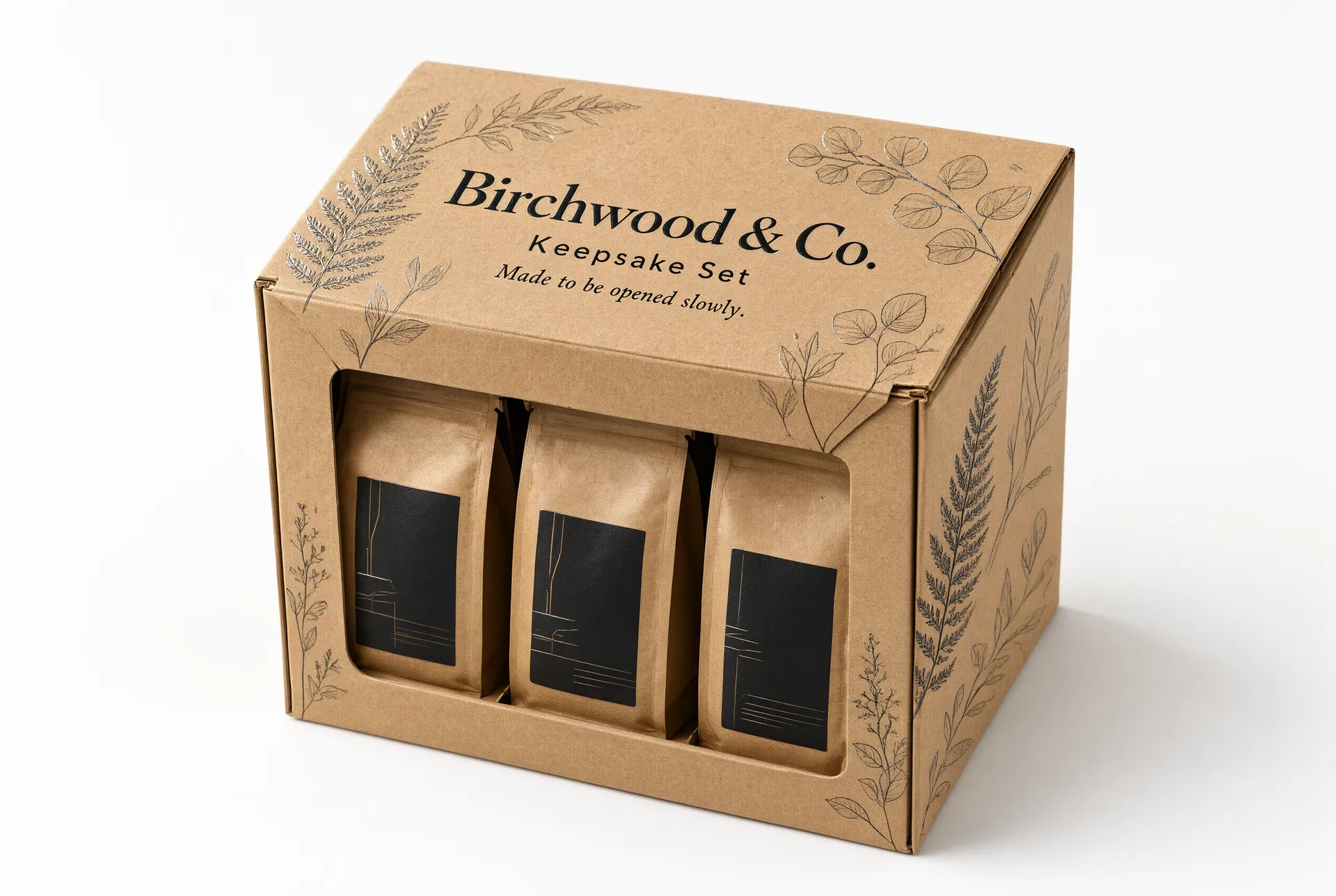 Closed kraft brown folding carton with a window showing three coffee pouches inside