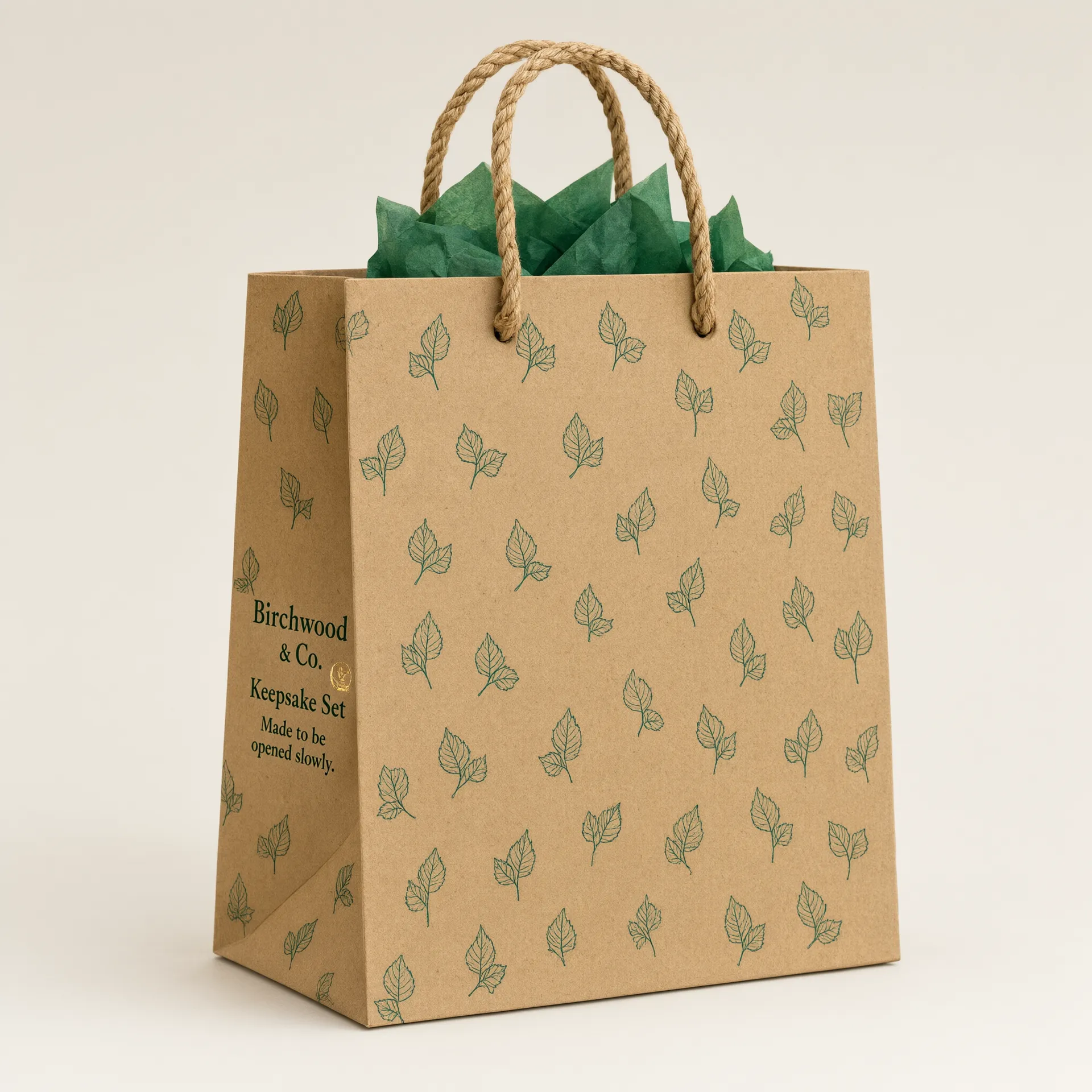 Side angle of a kraft gift bag showing the rope handle attachment