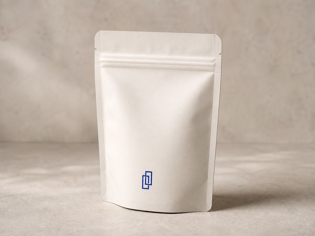 White reusable zipper pouch standing on a neutral surface