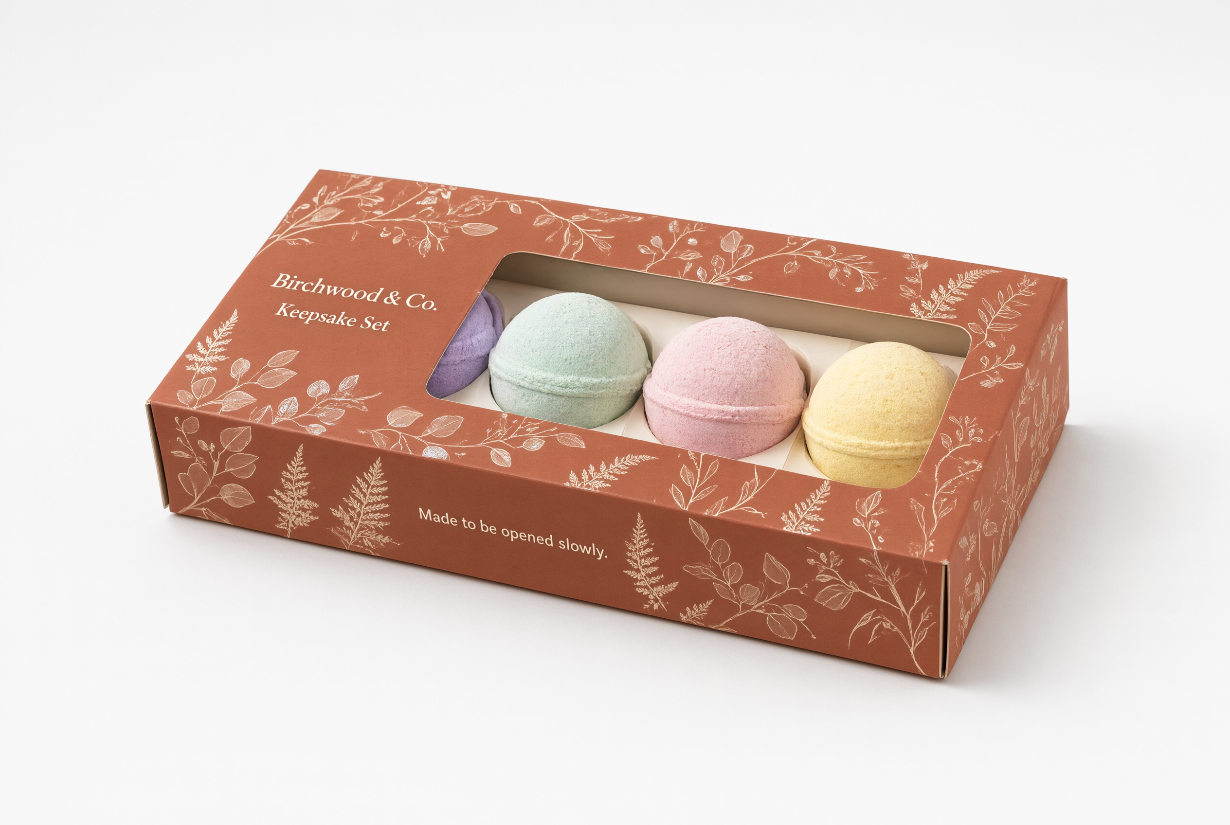 Different angle of the terracotta bath bomb gift set carton showing the spot UV botanical motif
