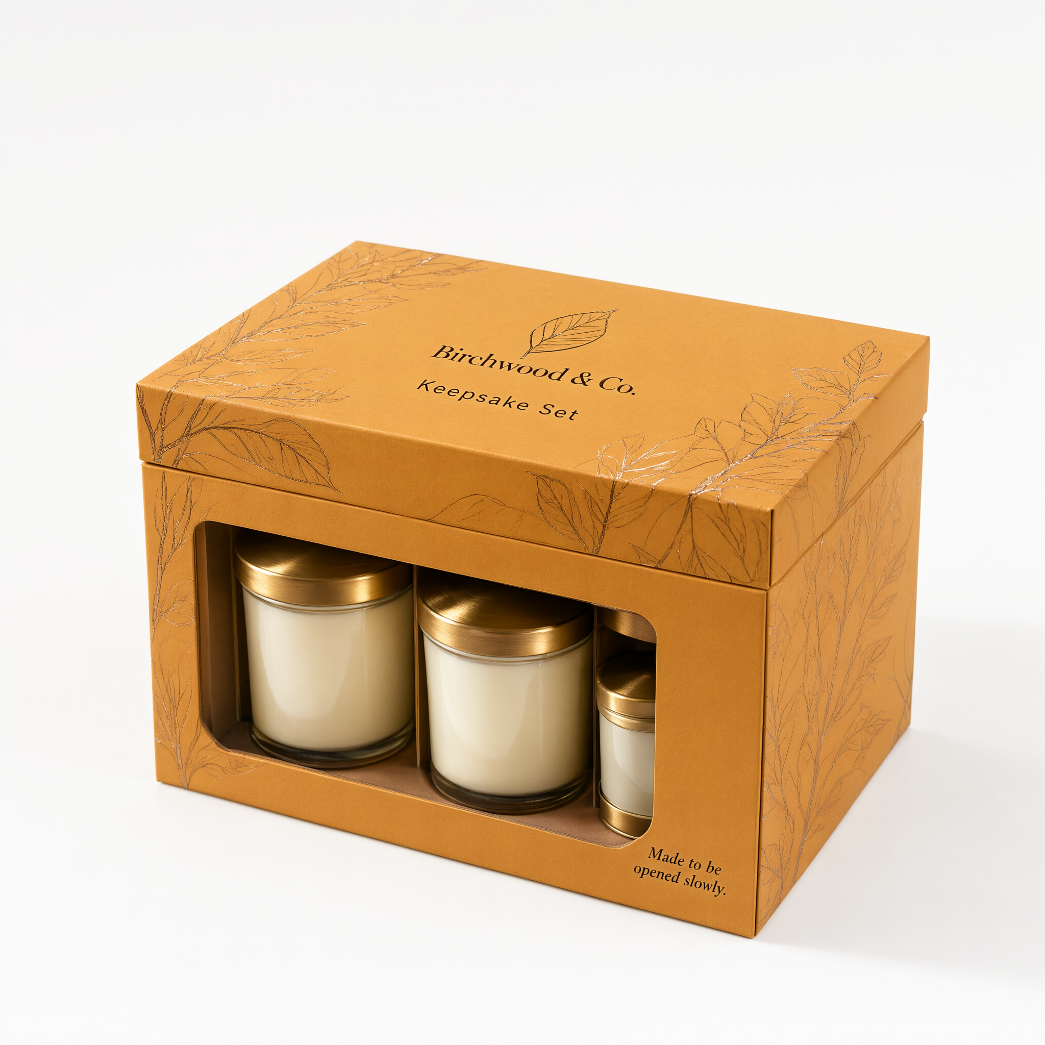 Three-quarter angle of the honey amber rigid candle gift box showing the foil-stamped lid