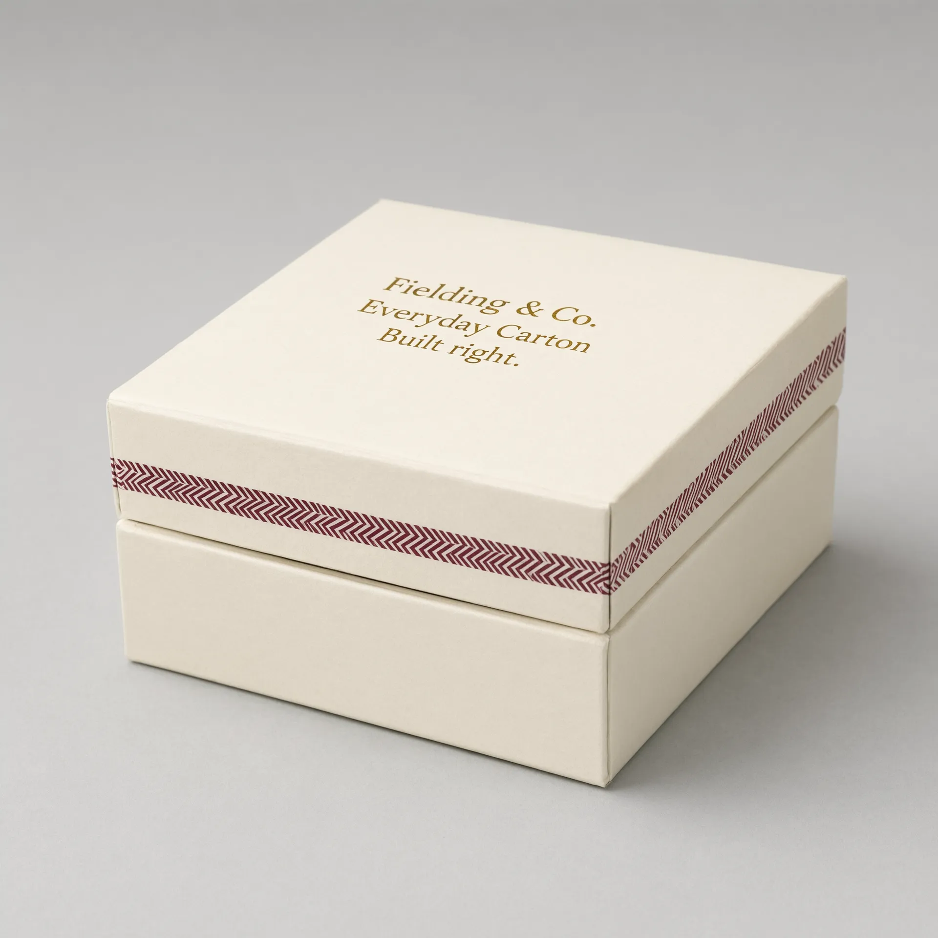 Side angle of an ivory rigid jewelry box with its lid seated