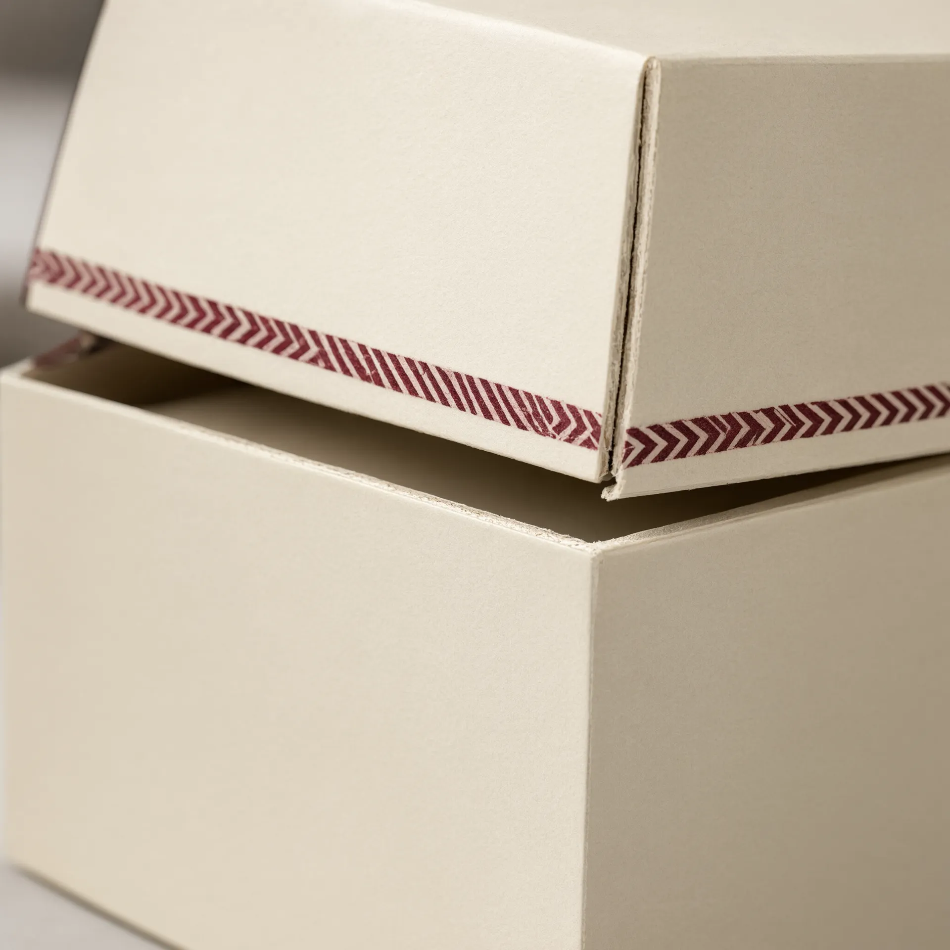 Close-up of a rigid jewelry box lid lifting off its base